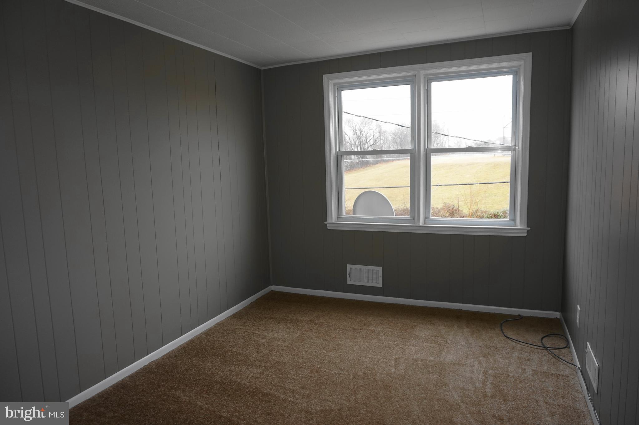 7459 School Avenue Dundalk, MD 21222 - Photo 16 of 23 an empty room with a window