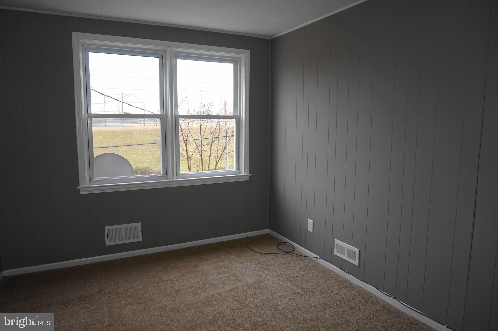 7459 School Avenue Dundalk, MD 21222 - Photo 17 of 23 a view of an empty room with a window