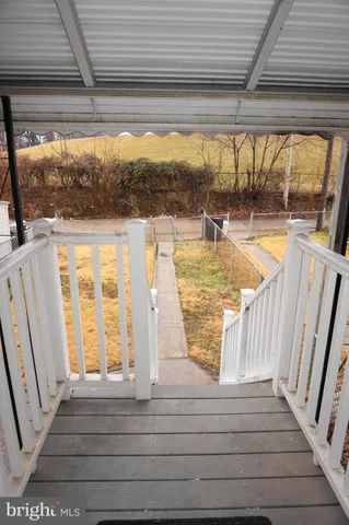 a view of swimming pool with wooden floor and door