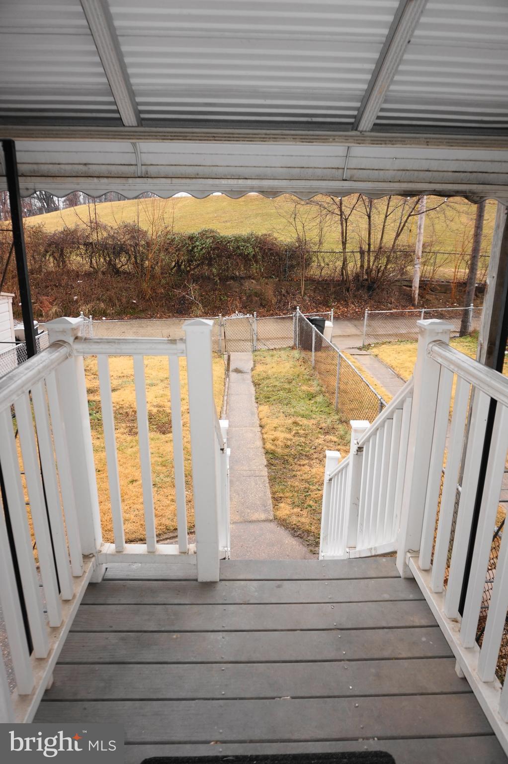 7459 School Avenue Dundalk, MD 21222 - Photo 10 of 23 a view of swimming pool with wooden floor and door