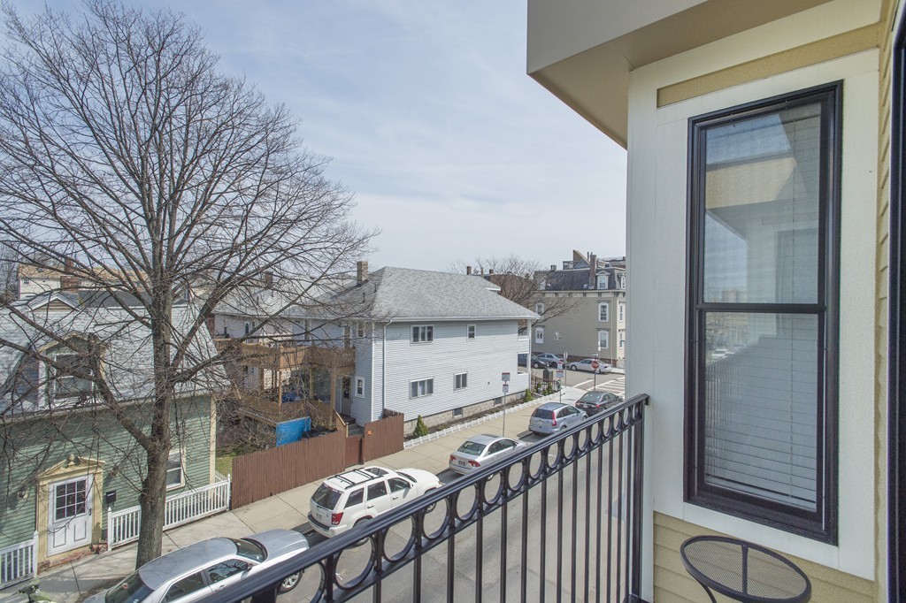 37 P Street, Unit 4 Boston, MA 02127 - Photo 11 of 13 a view of a balcony with wooden floor