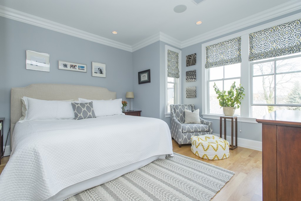 37 P Street, Unit 4 Boston, MA 02127 - Photo 5 of 13 a bedroom with a bed and wooden floor