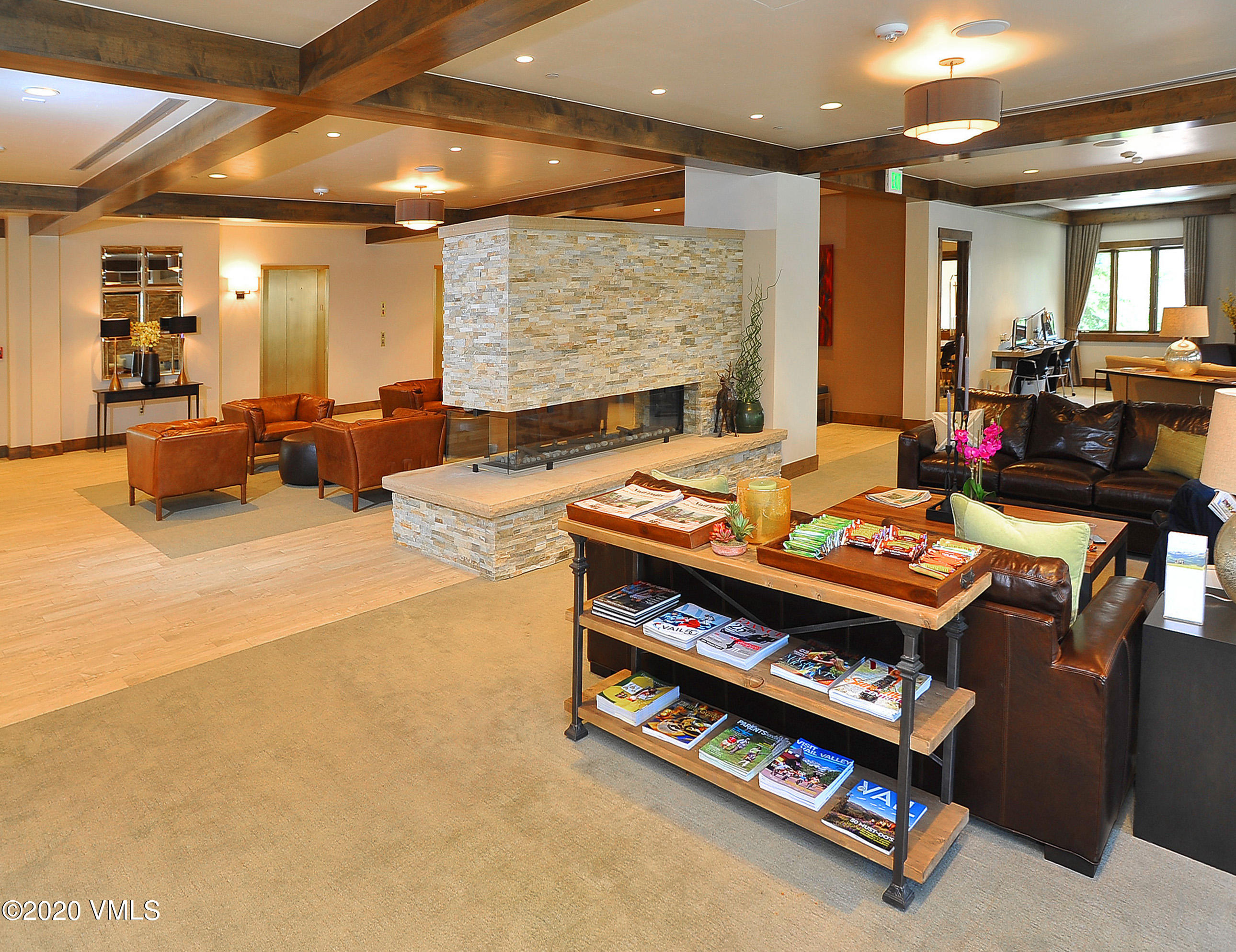 210 Offerson Road, Unit 115 WEEK 38 Beaver Creek, CO 81620 - Photo 25 of 37 a living room with furniture a rug kitchen view and a large window