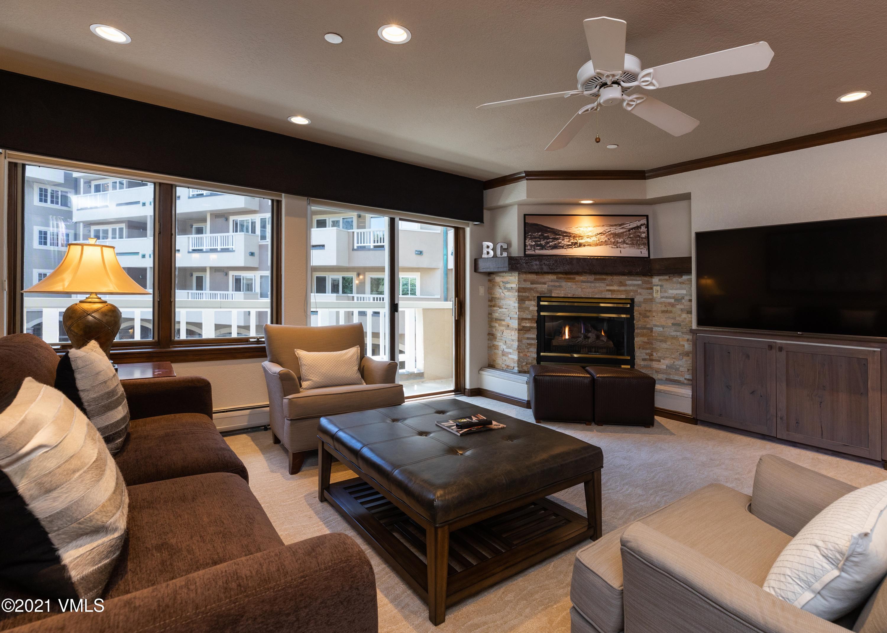 210 Offerson Road, Unit 115 WEEK 38 Beaver Creek, CO 81620 - Photo 32 of 37 a living room with furniture a flat screen tv and a large window