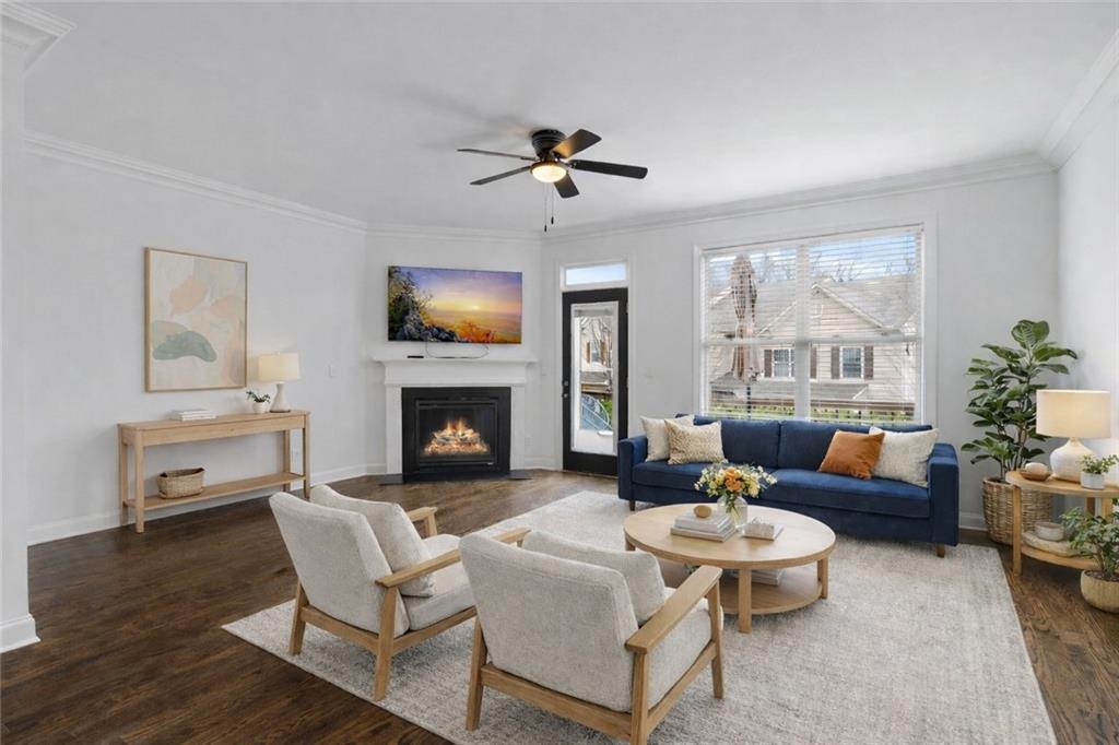 7054 Elmwood Ridge Court Atlanta, GA 30340 - Photo 11 of 44 a living room with furniture fireplace and a large window