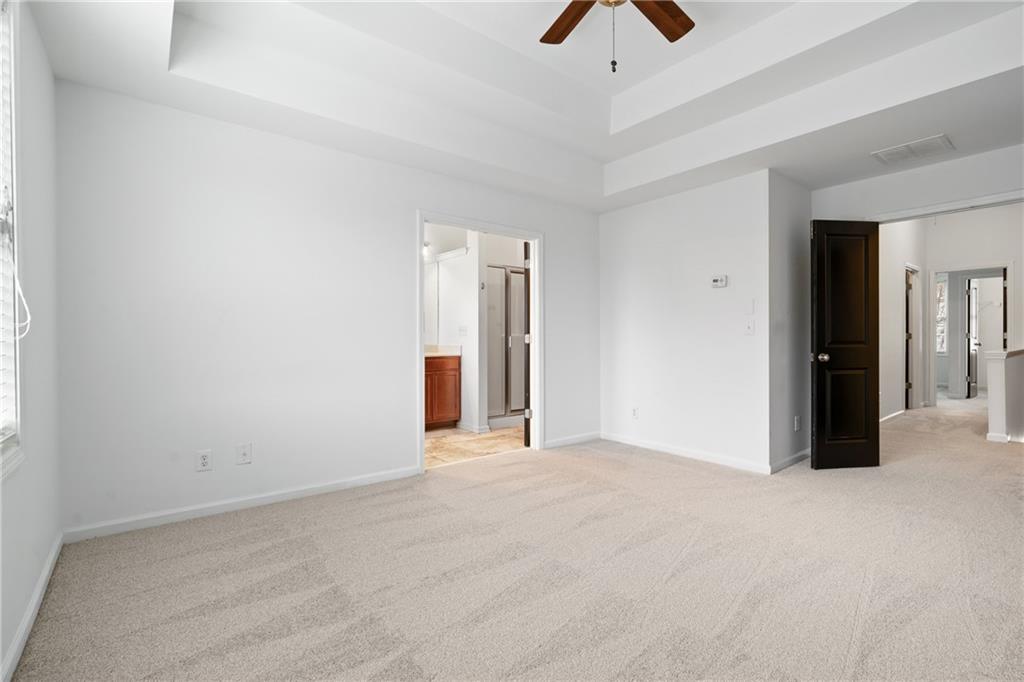 7054 Elmwood Ridge Court Atlanta, GA 30340 - Photo 17 of 44 an empty room with chandelier fan and closet