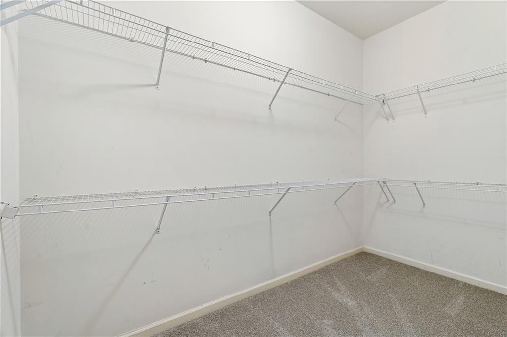 7054 Elmwood Ridge Court Atlanta, GA 30340 - Photo 20 of 44 a view of a room with racks on the wall