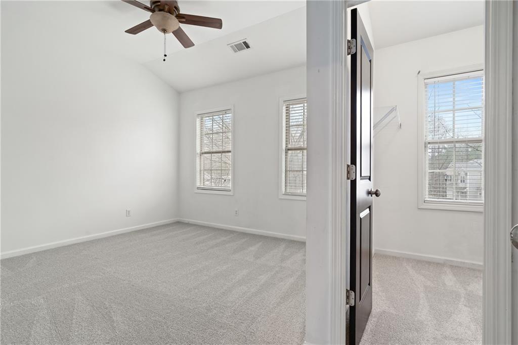 7054 Elmwood Ridge Court Atlanta, GA 30340 - Photo 23 of 44 a view of room with window and ceiling fan