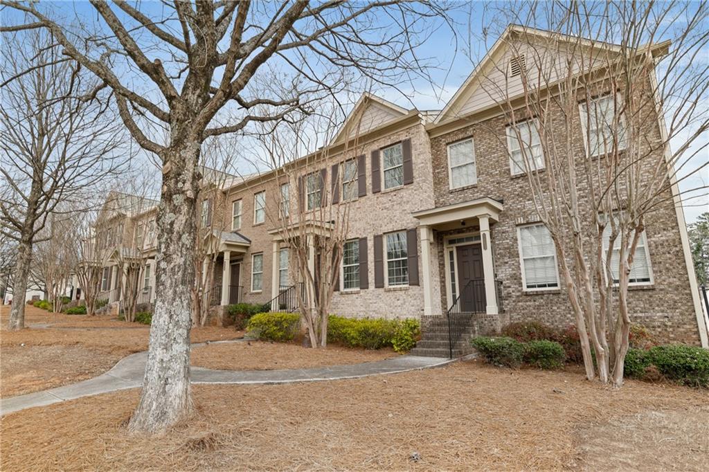 7054 Elmwood Ridge Court Atlanta, GA 30340 - Photo 34 of 44 a front view of a residential houses with yard and trees