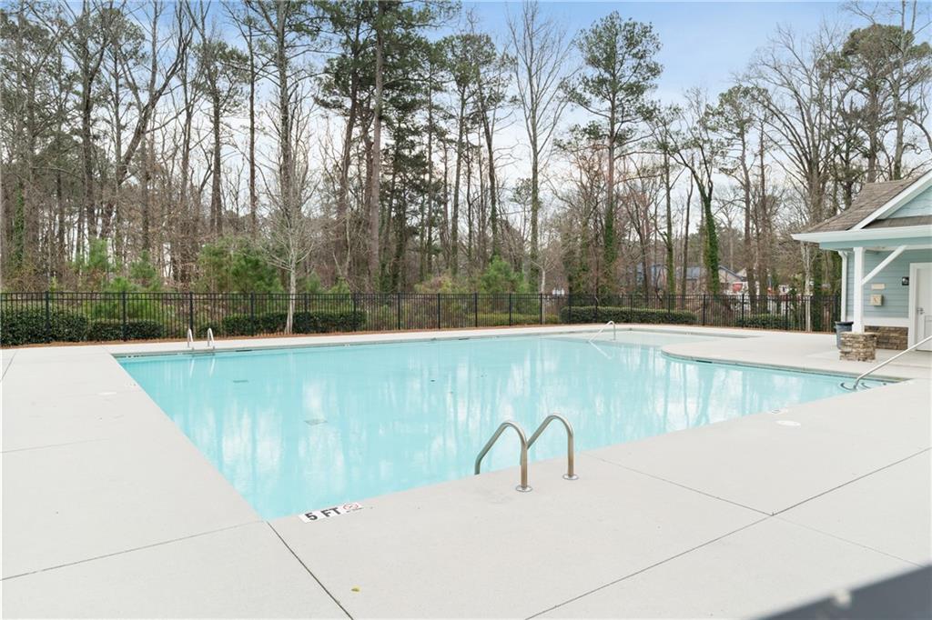 7054 Elmwood Ridge Court Atlanta, GA 30340 - Photo 35 of 44 a view of a swimming pool with a yard