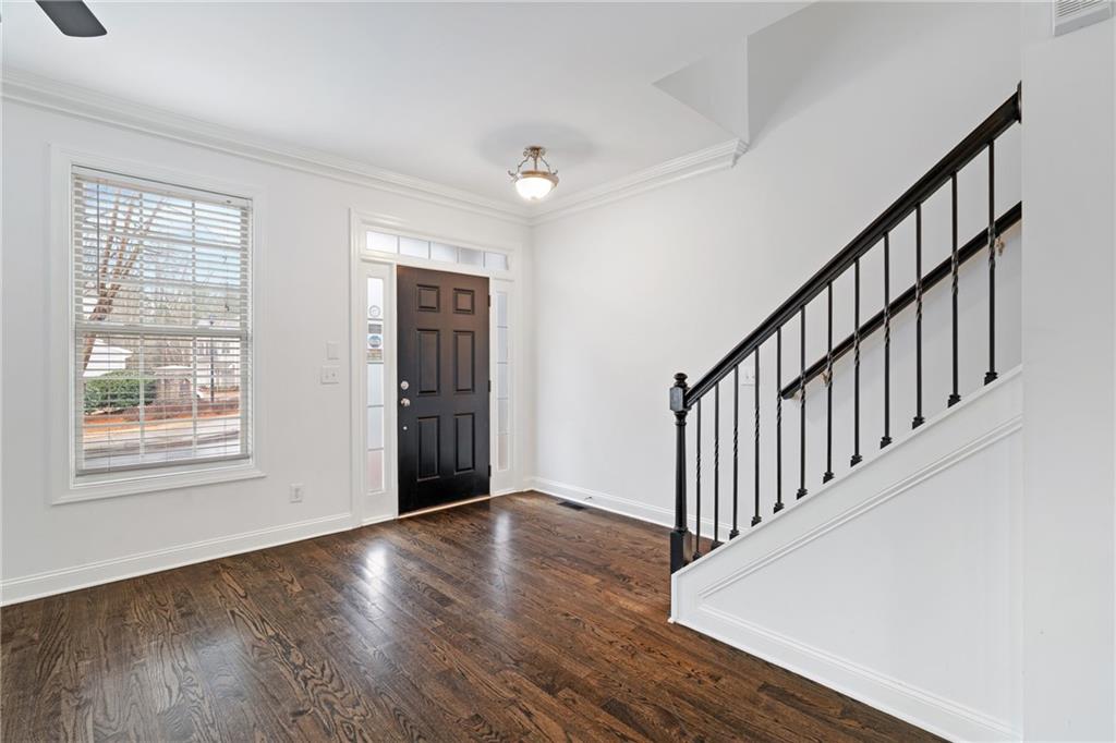 7054 Elmwood Ridge Court Atlanta, GA 30340 - Photo 4 of 44 a view of an empty room with wooden floor and a window
