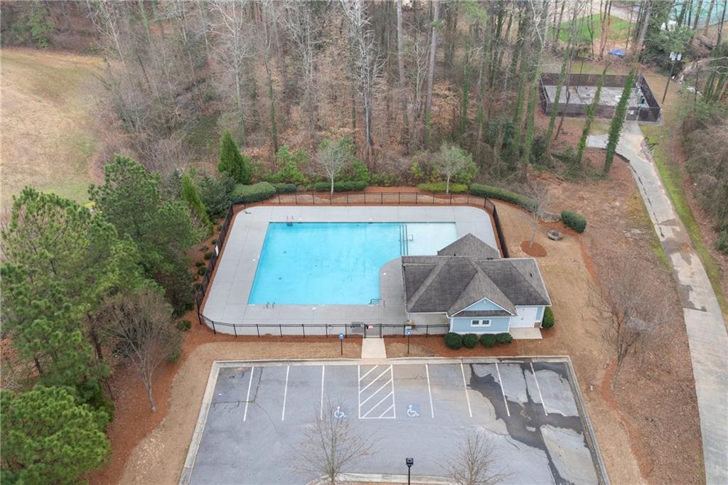 7054 Elmwood Ridge Court Atlanta, GA 30340 - Photo 43 of 44 a small pool with a table and chairs