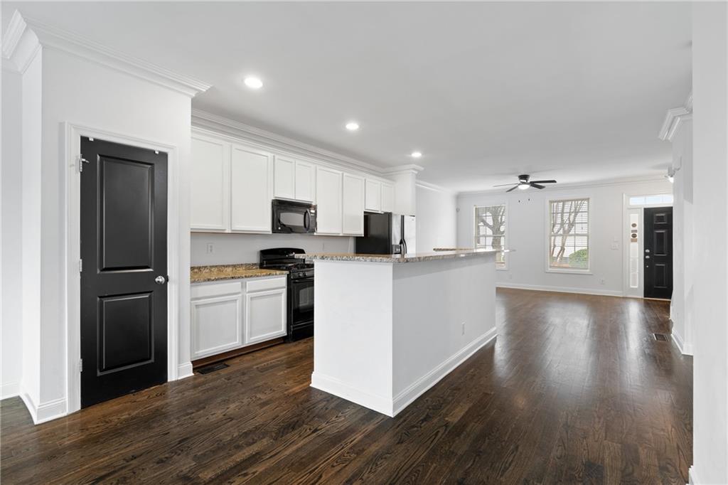 7054 Elmwood Ridge Court Atlanta, GA 30340 - Photo 8 of 44 a kitchen with a refrigerator and a sink