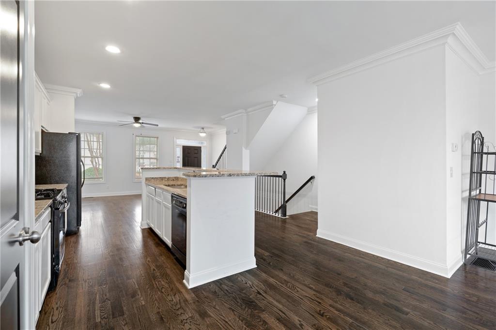 7054 Elmwood Ridge Court Atlanta, GA 30340 - Photo 10 of 44 a view of a kitchen with wooden floor and electronic appliances