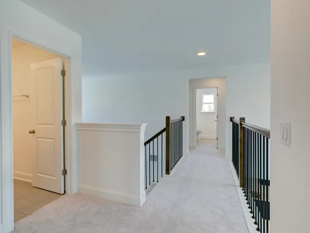 a view of a hallway with entryway door