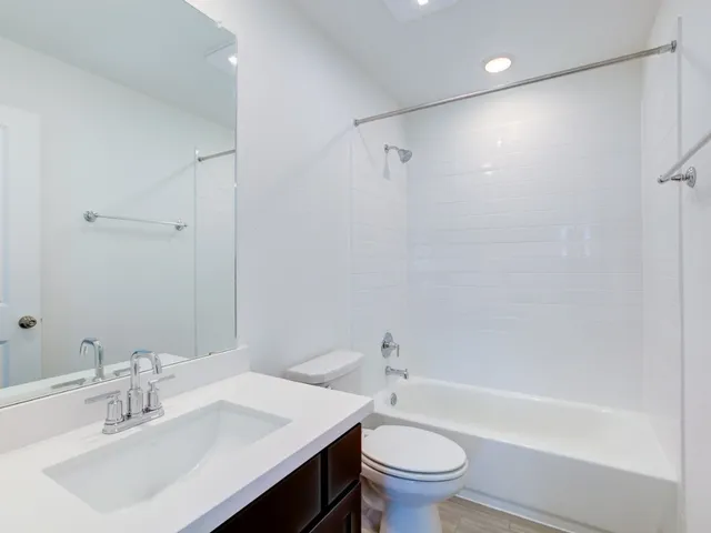a bathroom with a sink toilet and a bathtub