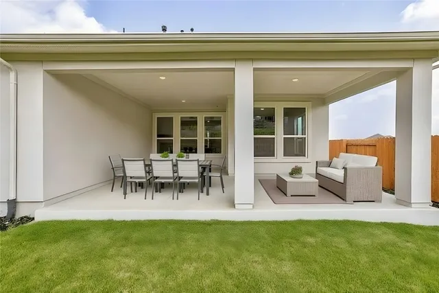 a view of a two chairs in the patio