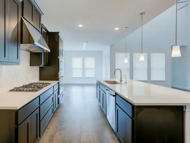 a kitchen with counter top space and stove