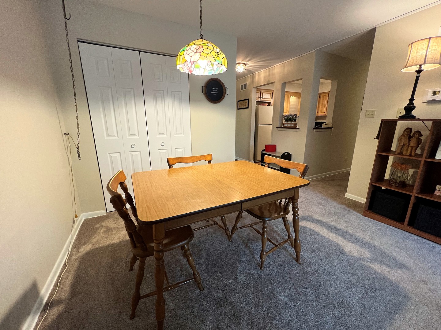 2311 183rd Street, Unit 206B Homewood, IL 60430 - Photo 11 of 26 a view of a dining room with furniture and chandelier