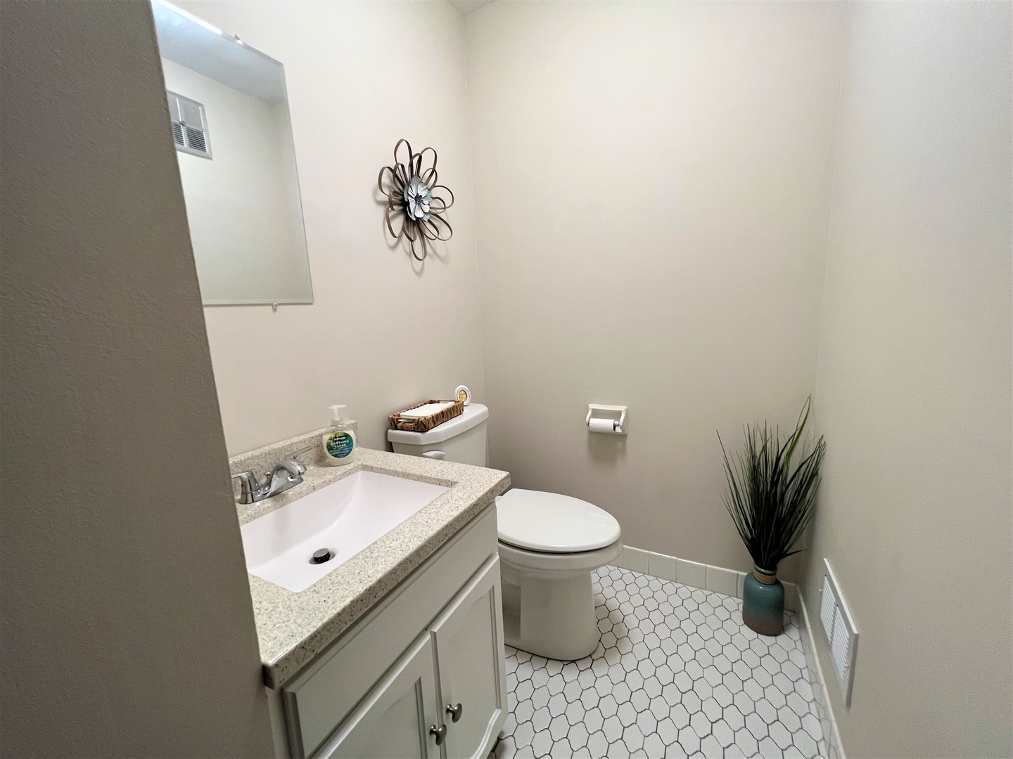 2311 183rd Street, Unit 206B Homewood, IL 60430 - Photo 18 of 26 a bathroom with a sink a toilet and a mirror