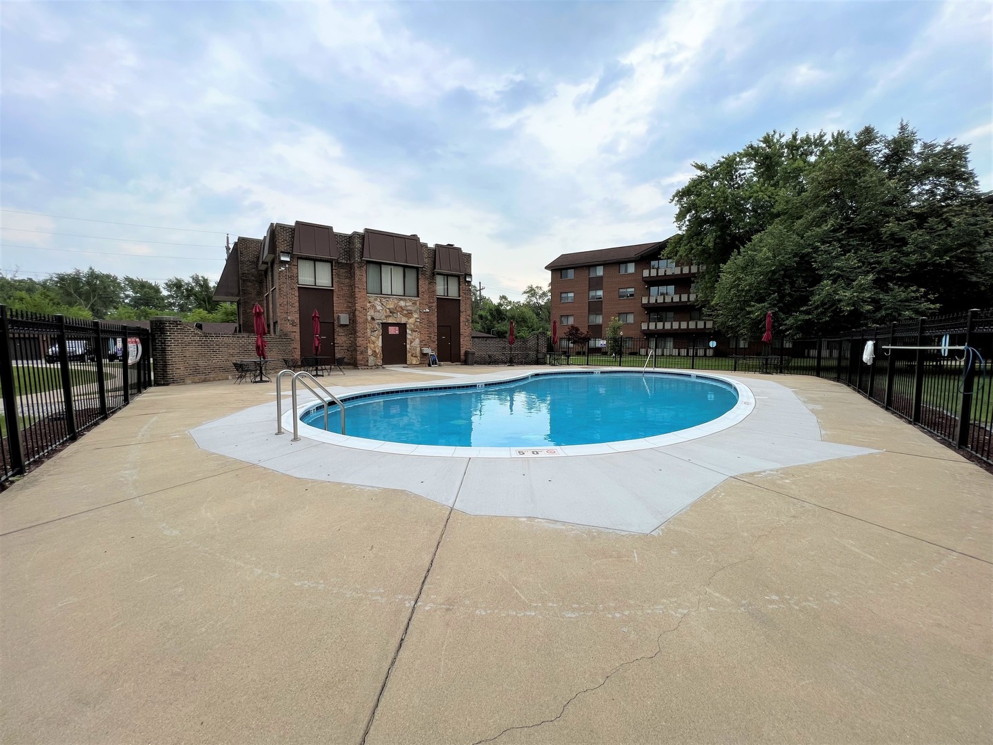 2311 183rd Street, Unit 206B Homewood, IL 60430 - Photo 25 of 26 a view of a swimming pool with a terrace