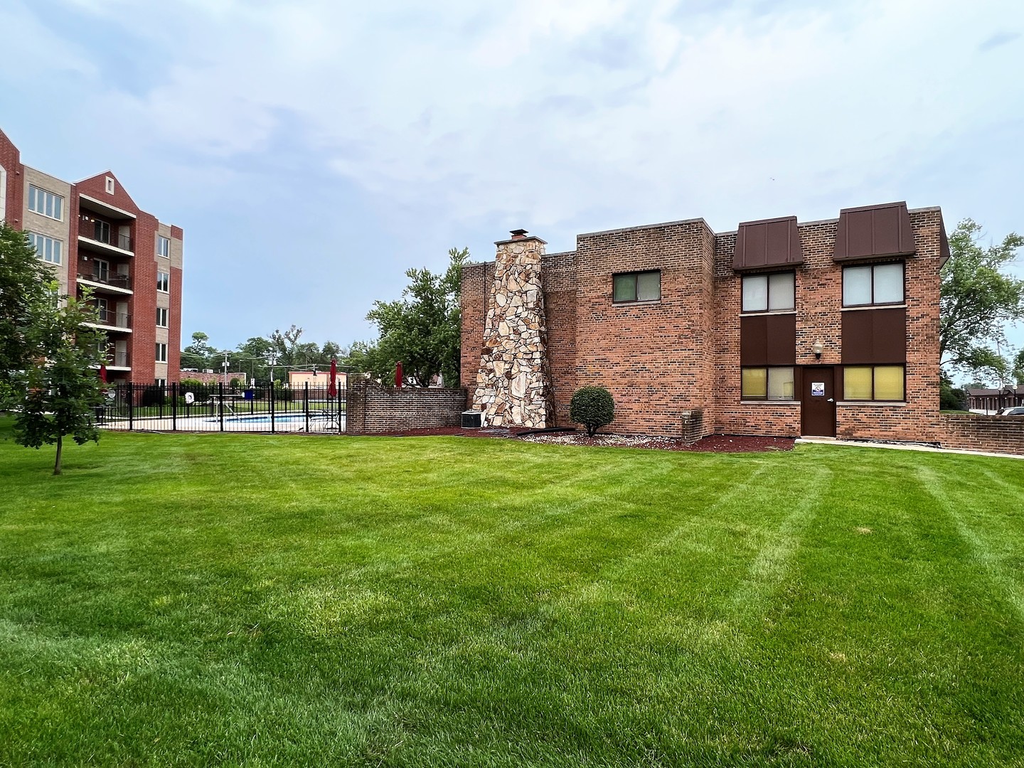 2311 183rd Street, Unit 206B Homewood, IL 60430 - Photo 26 of 26 a view of a building with a yard