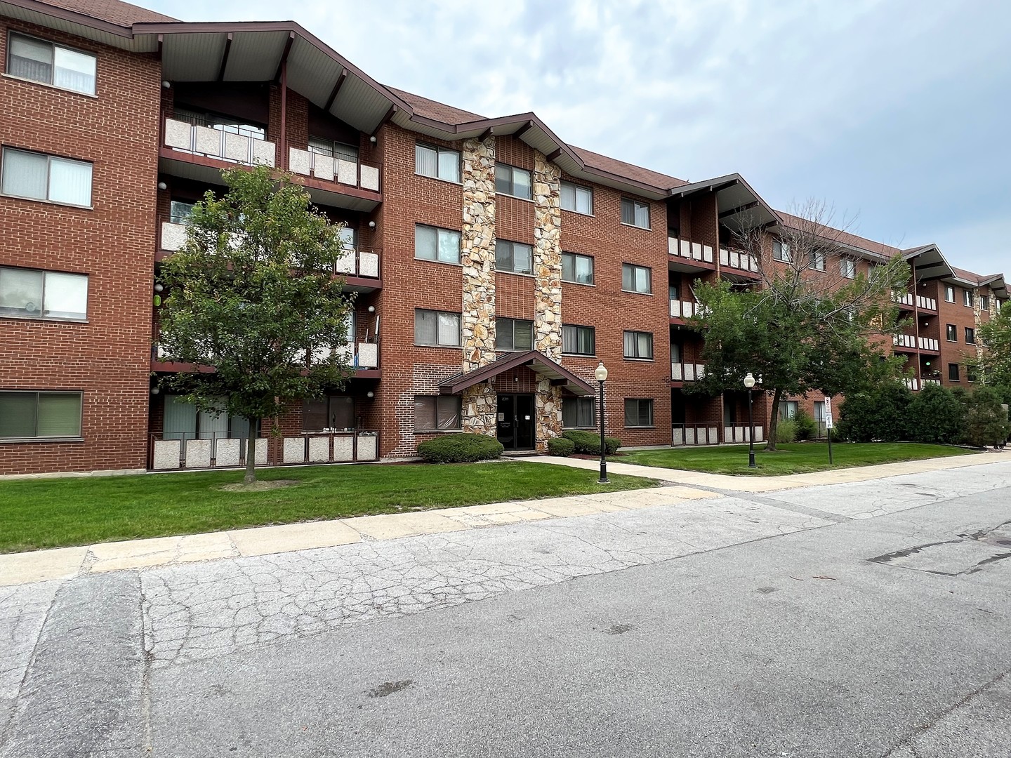 2311 183rd Street, Unit 206B Homewood, IL 60430 - Photo 3 of 26 a city view with tall buildings and a yard