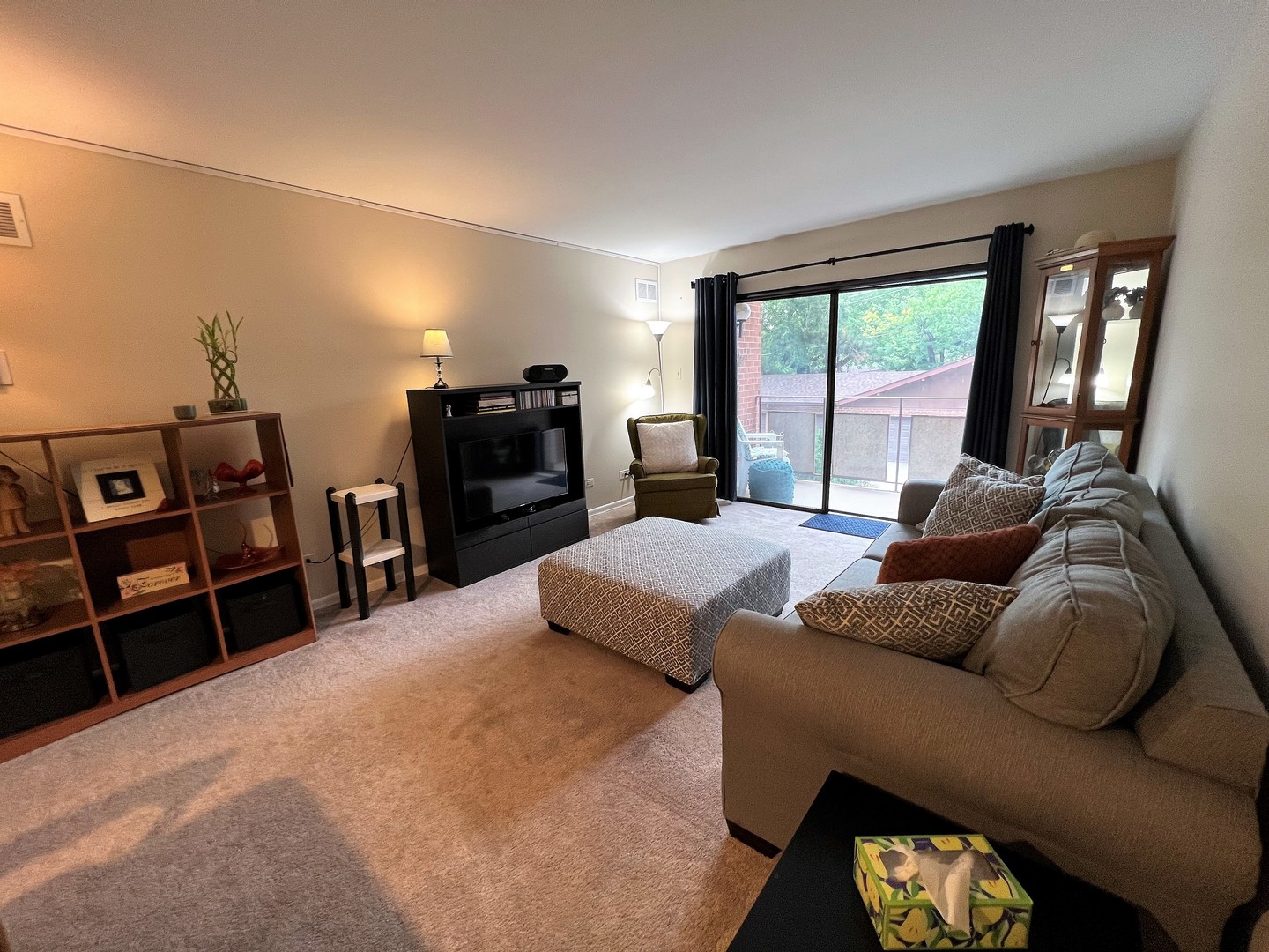 2311 183rd Street, Unit 206B Homewood, IL 60430 - Photo 9 of 26 a large bedroom with a bed and a television