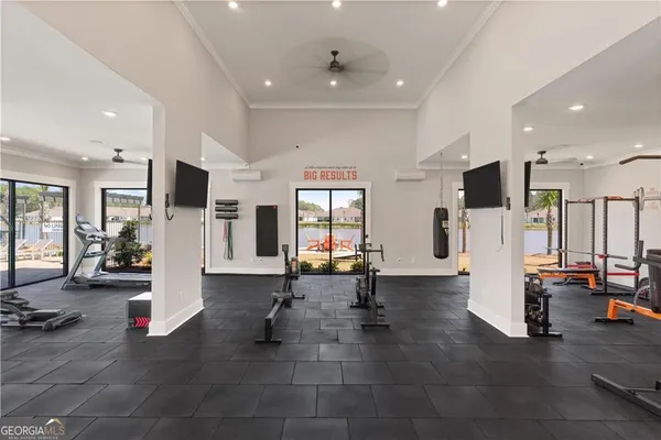 a living room with furniture and large window