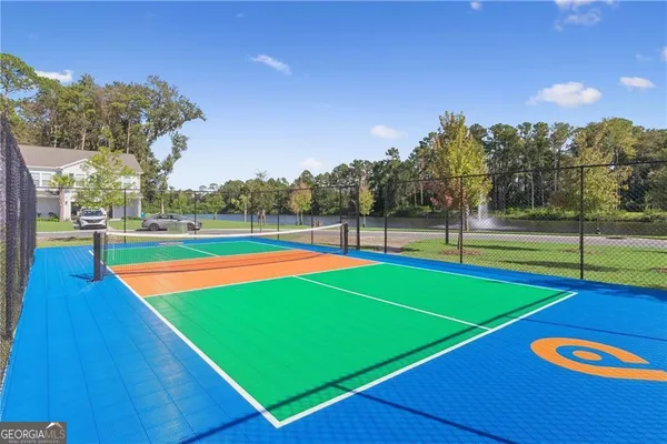a view of an outdoor space and tennis court