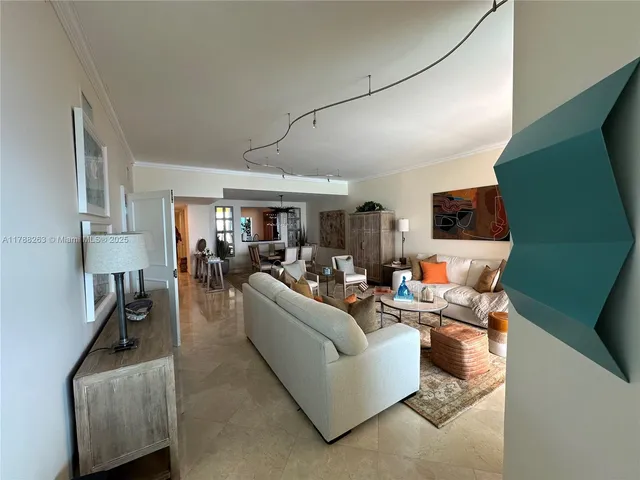 a dining room with wooden floor and a rug