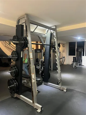a table with wine bottles and glasses on it
