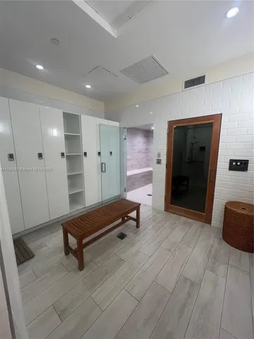 a bathroom with a sink and shower