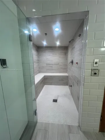 a room with pool table and a couch