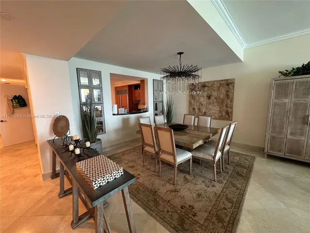 a living room with furniture a rug and a large window