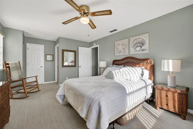 a bedroom with a bed and dresser