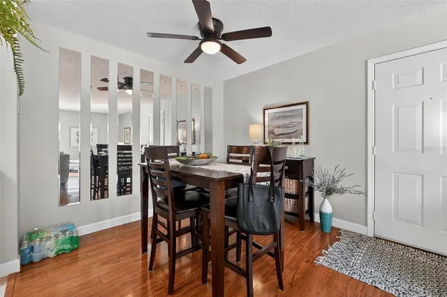 a view of a dining room with furniture and wooden floor