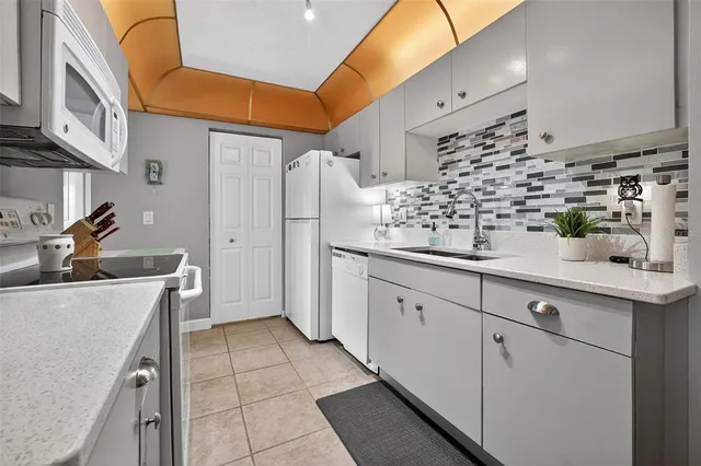 a kitchen with a sink and cabinets