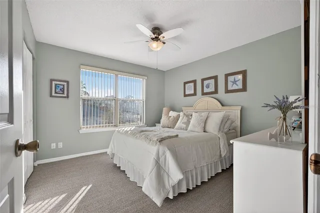 a bed room with a bed and a window