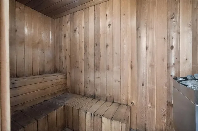 a room with furniture pool table and windows