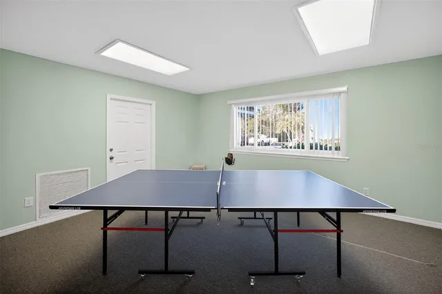 a living room with fireplace furniture and a flat screen tv