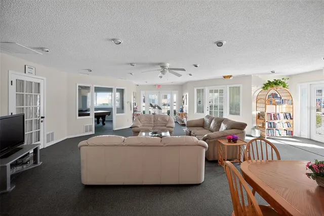 a kitchen with stainless steel appliances a refrigerator a stove a sink and a refrigerator