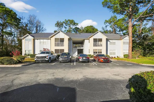 a view of a cars parked in front of a house