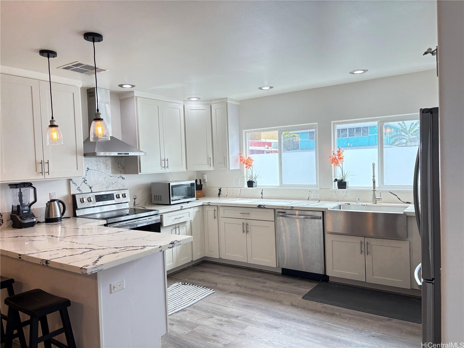 85-075 Waianae Valley Road, Unit B Waianae, HI 96792 - Photo 2 of 11 a kitchen with a sink stove and cabinets