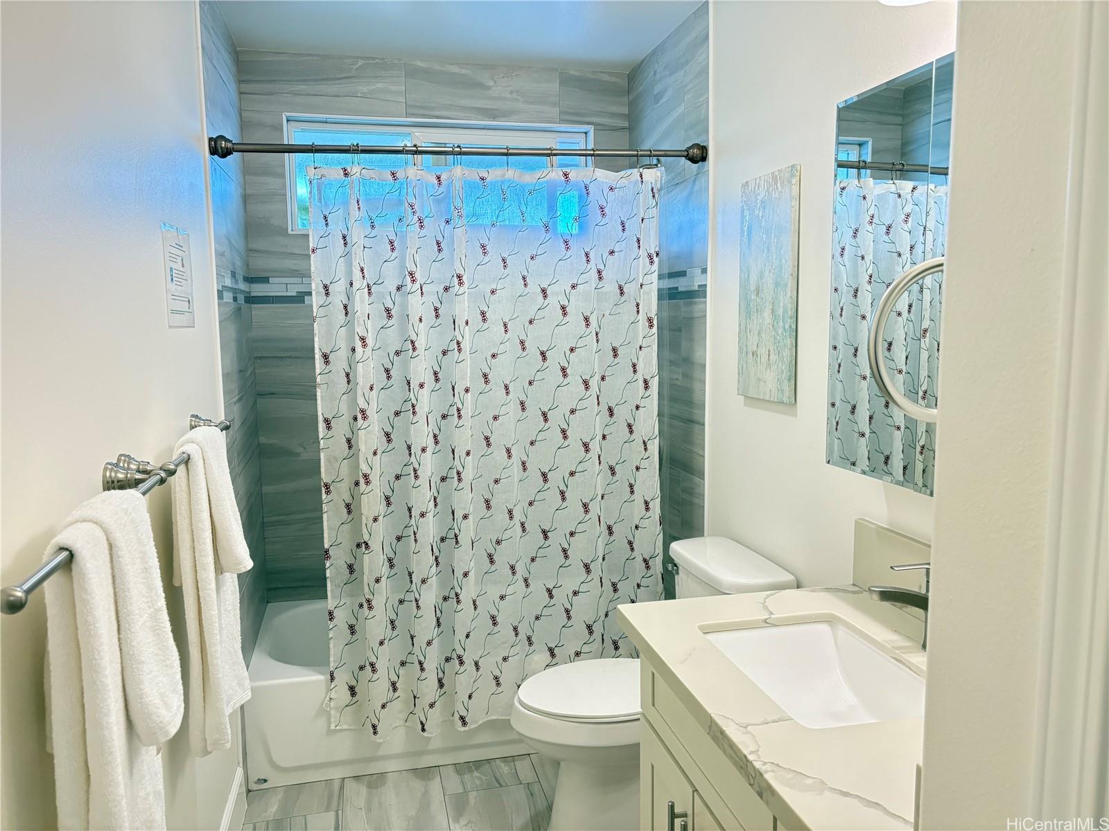 85-075 Waianae Valley Road, Unit B Waianae, HI 96792 - Photo 4 of 11 a bathroom with a sink and a toilet