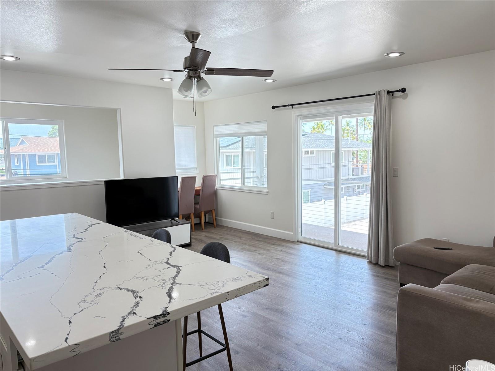 85-075 Waianae Valley Road, Unit B Waianae, HI 96792 - Photo 6 of 11 a living room with furniture and a flat screen tv