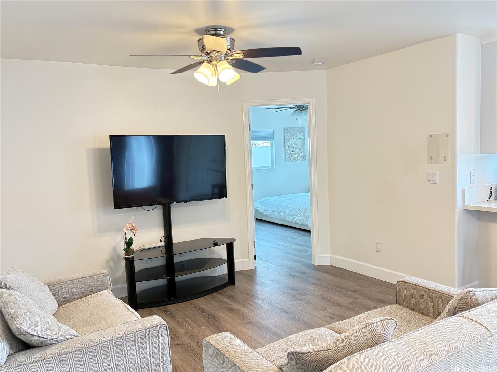 85-075 Waianae Valley Road, Unit B Waianae, HI 96792 - Photo 10 of 11 a living room with furniture and a flat screen tv