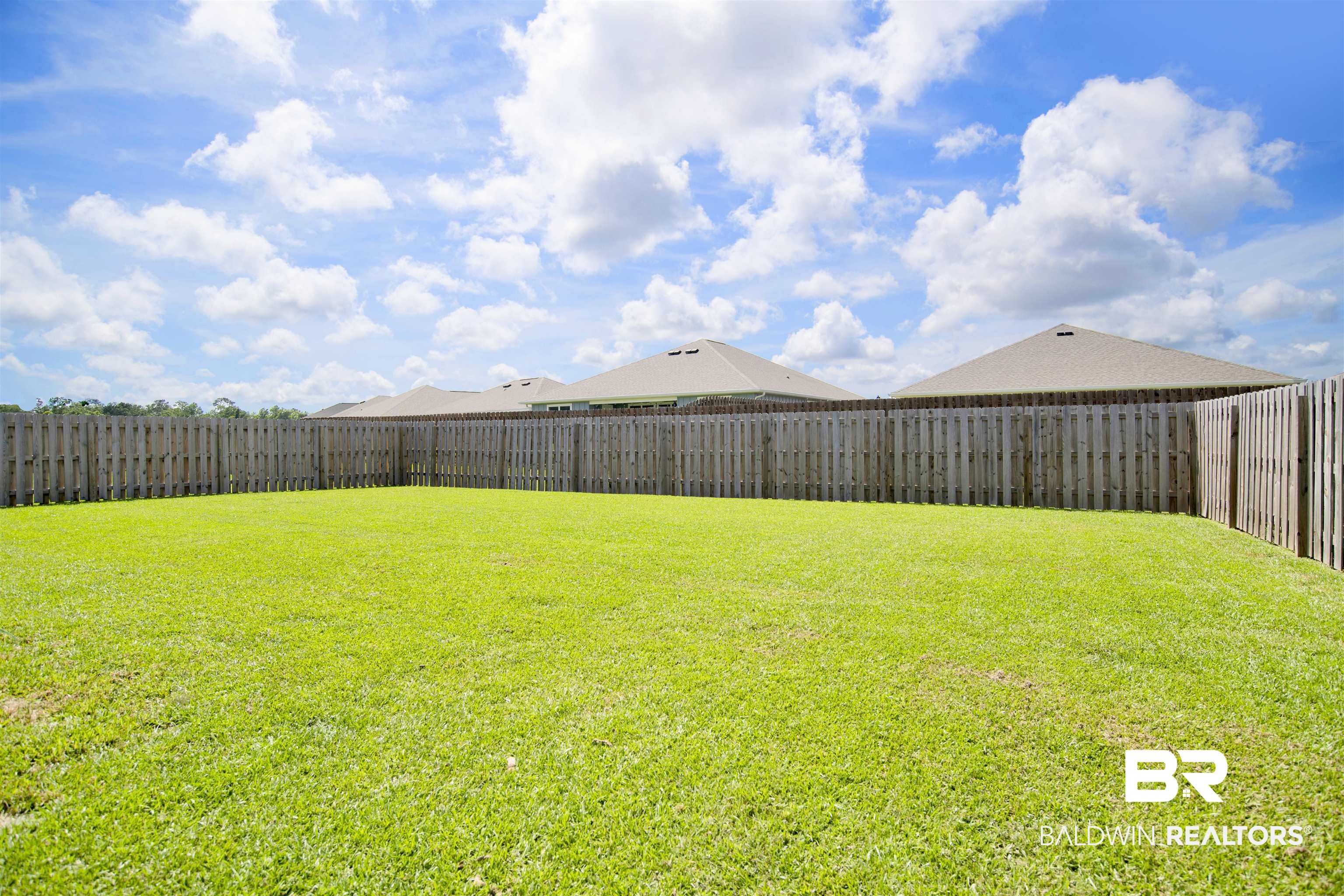 22301 Early Dawn Circle Foley, AL 36535 - Photo 34 of 45 Expansive green lawn providing ample outdoor space