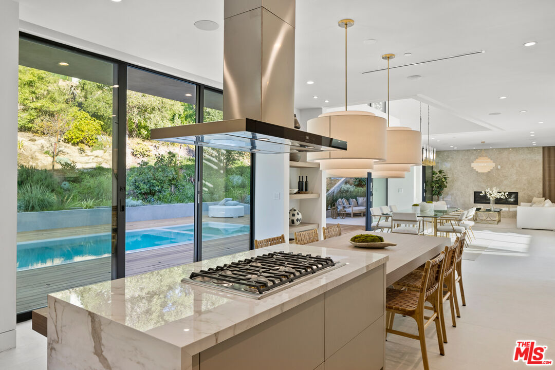 2814 Roscomare Road Los Angeles, CA 90077 - Photo 13 of 35 a kitchen with a table and chairs