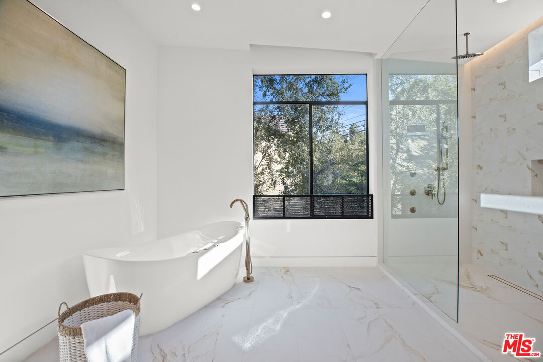 2814 Roscomare Road Los Angeles, CA 90077 - Photo 24 of 35 a bathroom with a bathtub and a shower